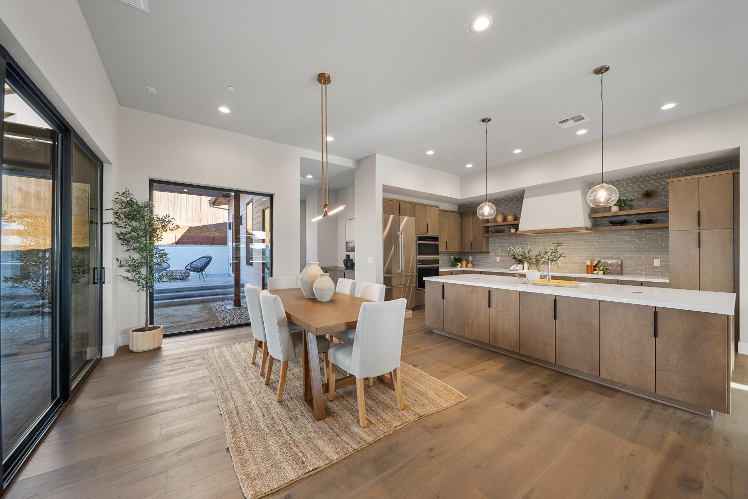1700 Ridgeview Circle Auburn, CA 95603 - Photo 26 of 39 a kitchen with a sink dining table and wooden floor