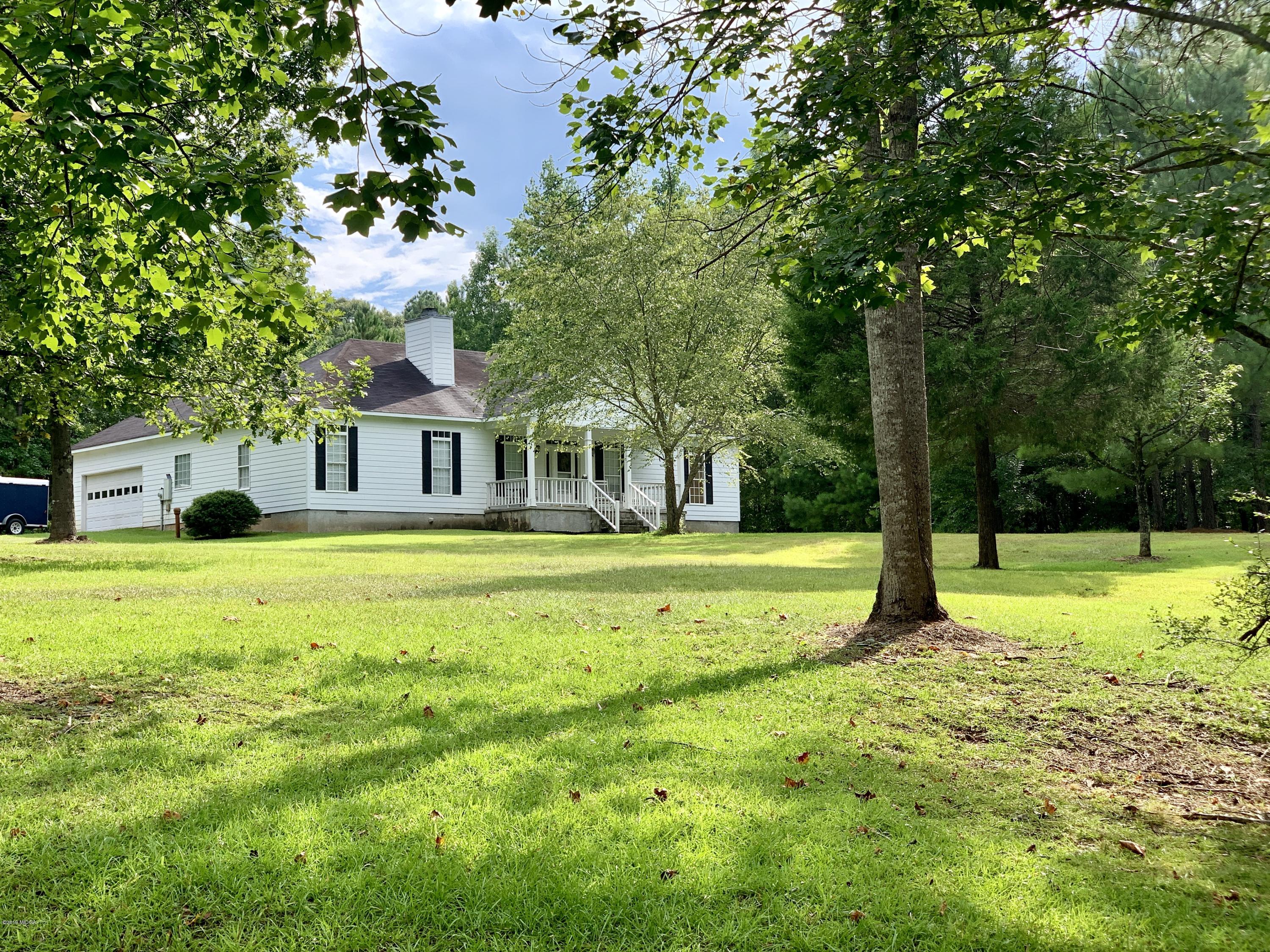 1325 Taylor Road Juliette, GA 31046 - Photo 1 of 18 a view of a house with a yard