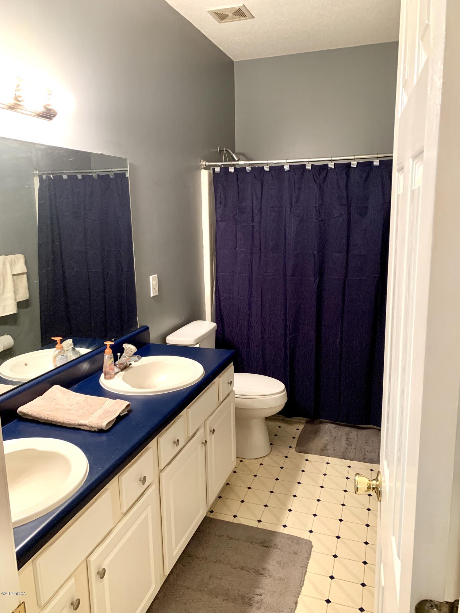 1325 Taylor Road Juliette, GA 31046 - Photo 14 of 18 a bathroom with a sink and a toilet