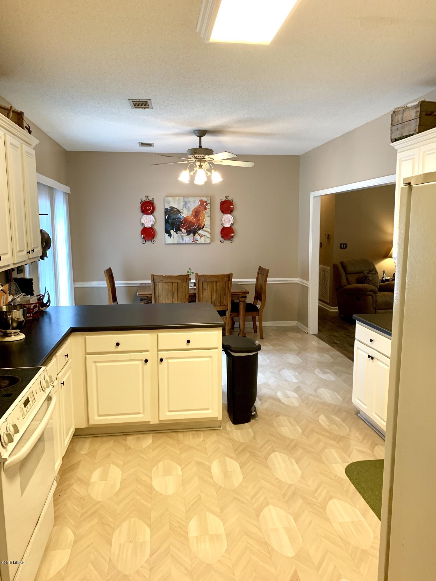 1325 Taylor Road Juliette, GA 31046 - Photo 15 of 18 a large white kitchen with a large window