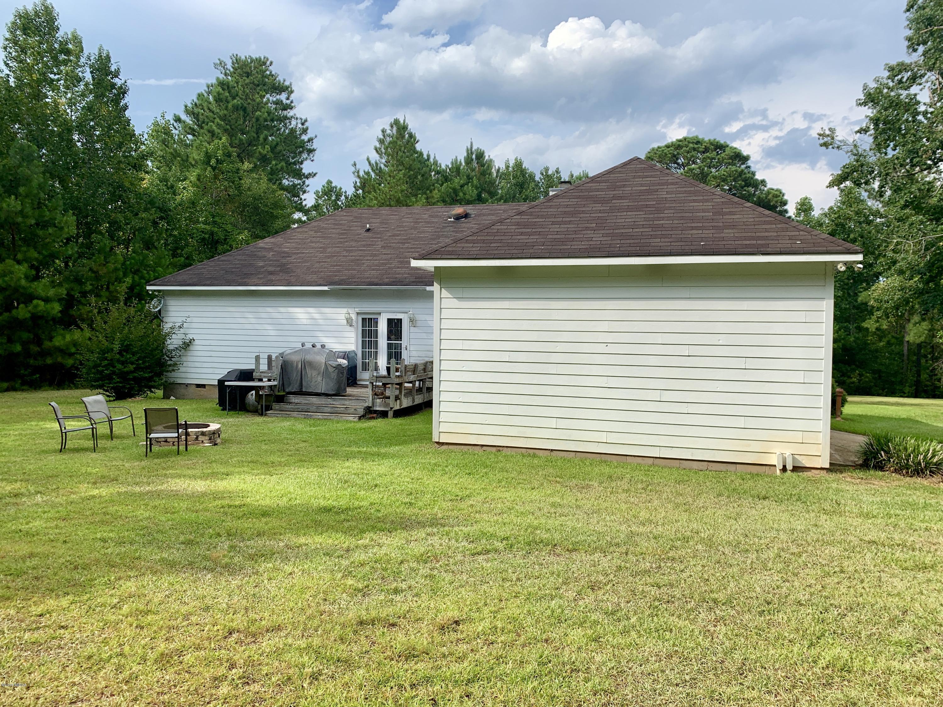 1325 Taylor Road Juliette, GA 31046 - Photo 6 of 18 a backyard of a house with table and chairs