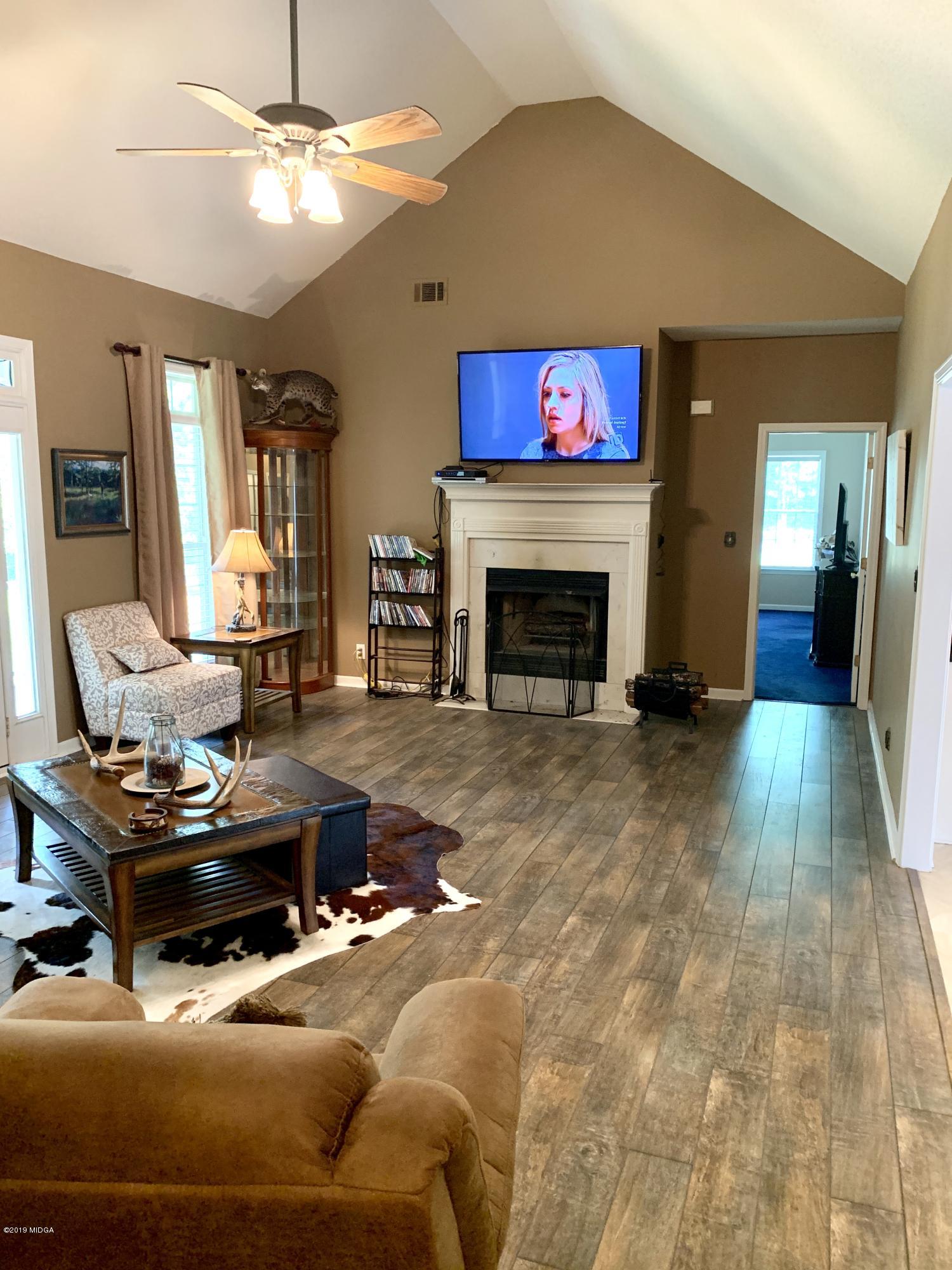 1325 Taylor Road Juliette, GA 31046 - Photo 7 of 18 a living room with furniture and a fireplace