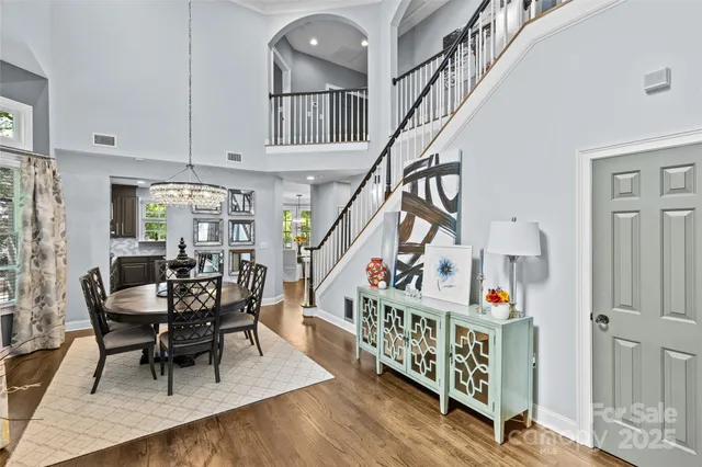 a view of entryway dining room and hall with wooden floor