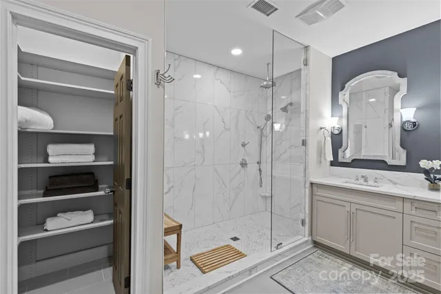 a bathroom with a shower and a sink