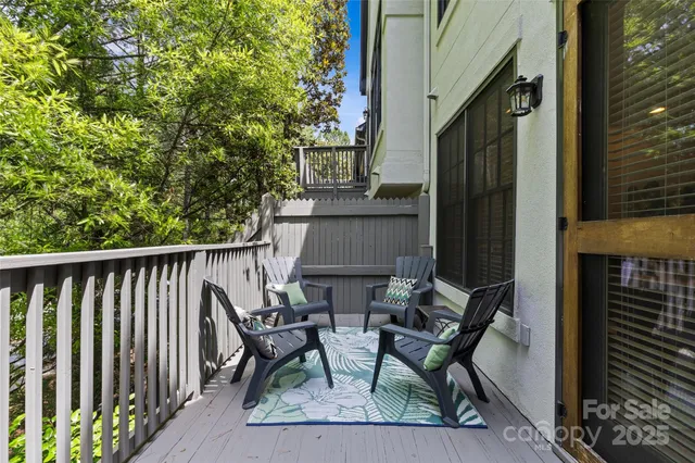 a view of balcony with furniture