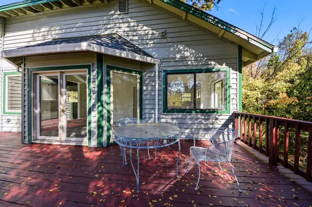 a view of a patio with a table and chairs