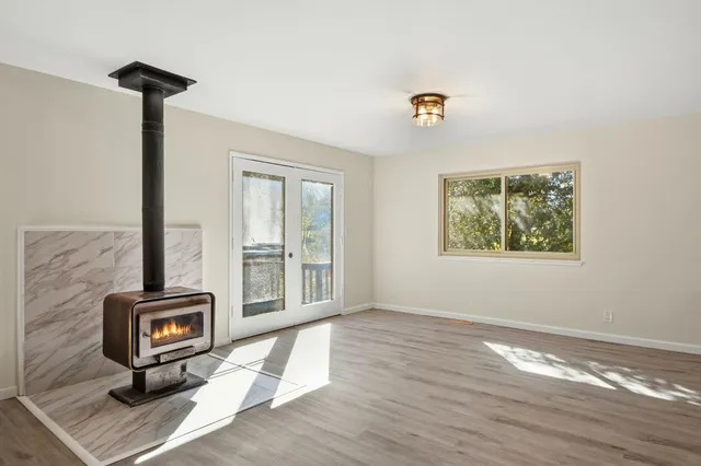a view of an entryway with wooden floor