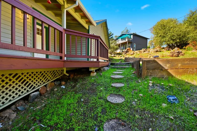 a backyard of a house with lots of green space