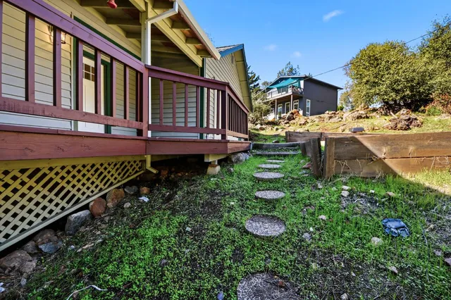a backyard of a house with lots of green space
