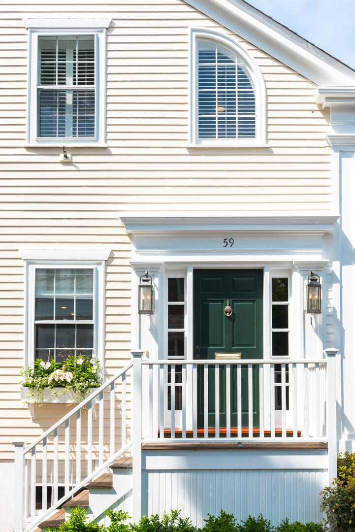 59 Orange Street Nantucket, MA 02554 - Photo 1 of 42 a view of a brick house with large windows