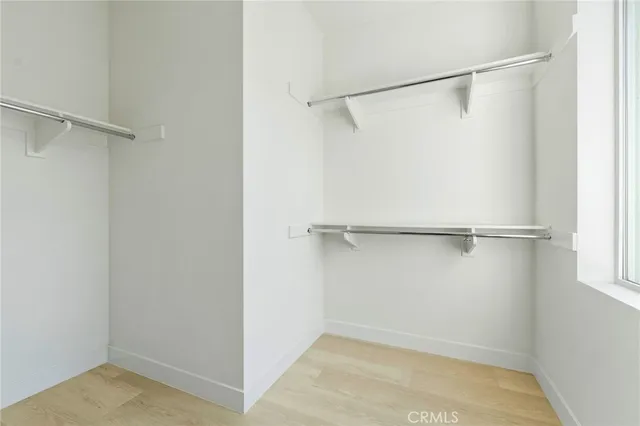 a view of an empty walk in closet