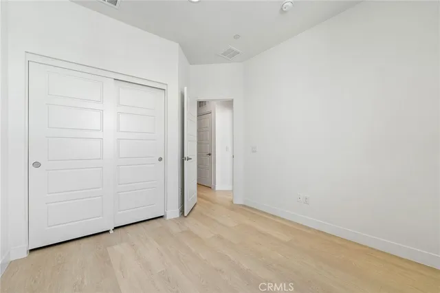an empty room with closet area
