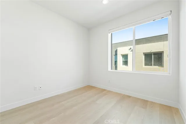 a front view of a brick house with a large windows