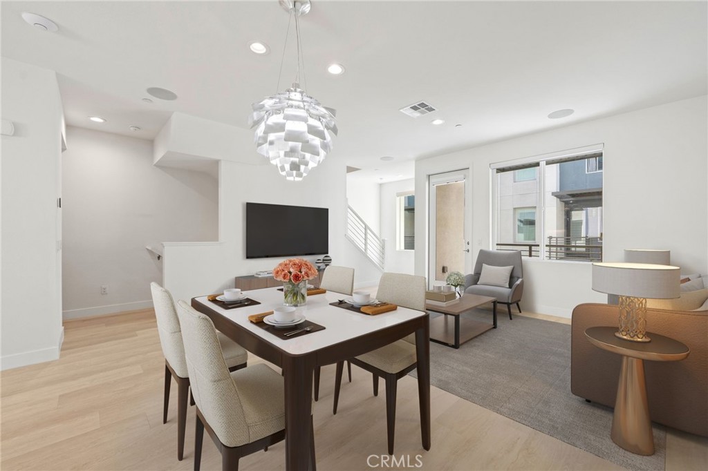 169 Steely Irvine, CA 92614 - Photo 8 of 31 Dining area with designer light fixture. Virtually staged