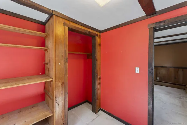 a view of entryway with a door and wooden floor