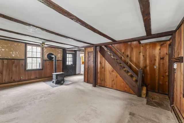 a view of an empty room with windows