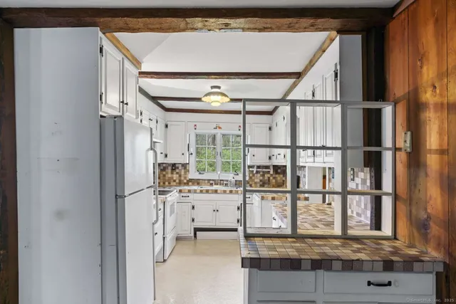 a view of kitchen with furniture and large window