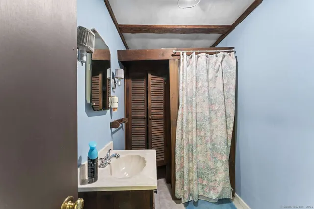 a bathroom with a sink and a mirror