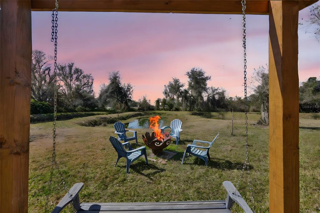 20112 Hobbs Road Wimauma, FL 33598 - Photo 50 of 94 a view of a lake with outdoor seating