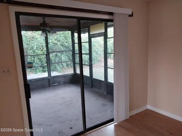 a view of hallway with wooden floor