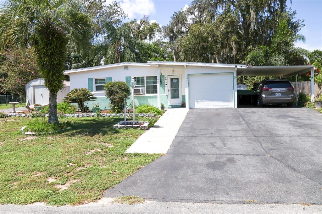 112 South Lunar Terrace Inverness, FL 34450 - Photo 1 of 1 a front view of a house with garden