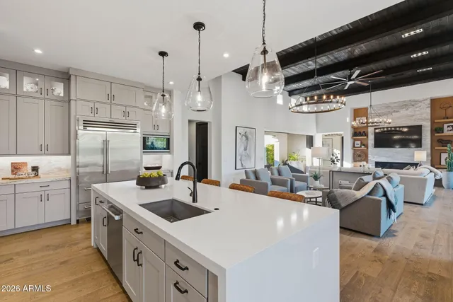a kitchen with granite countertop a stove top oven cabinetry and granite counter tops
