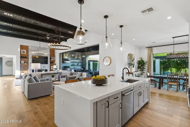 a large kitchen with a table and chairs