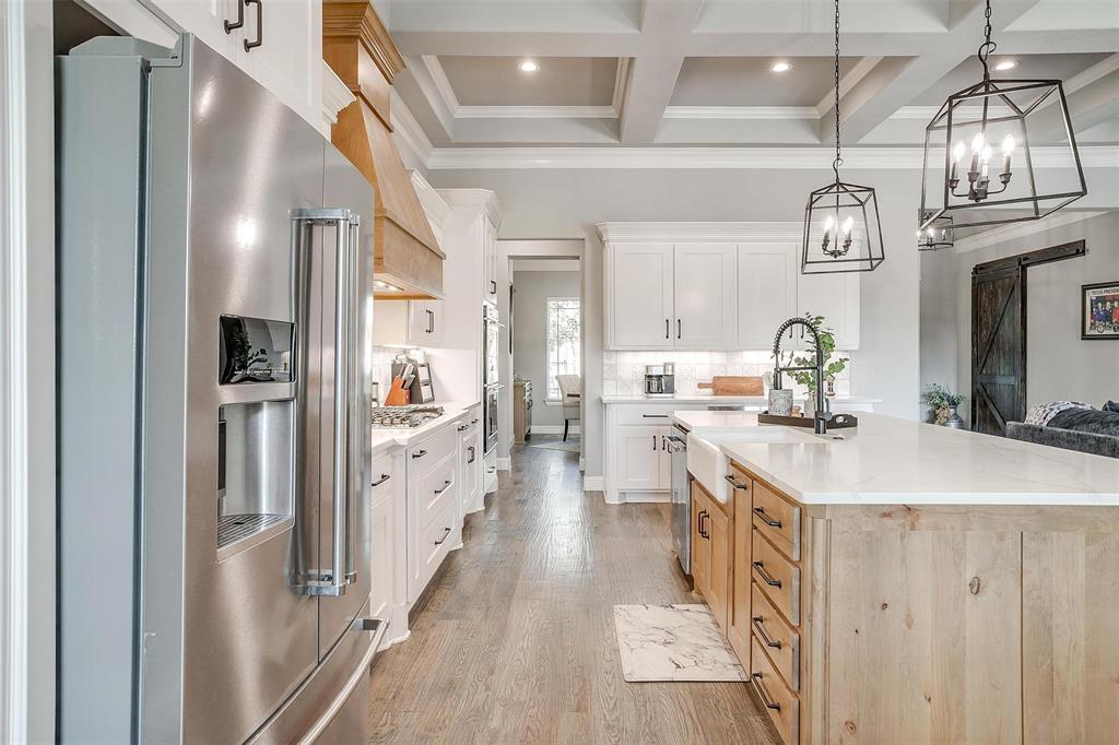 2161 Eagles Rdg Drive Weatherford, TX 76087 - Photo 16 of 40 a kitchen with kitchen island granite countertop lots of counter top space and stainless steel appliances