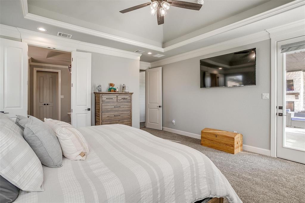 2161 Eagles Rdg Drive Weatherford, TX 76087 - Photo 19 of 40 a bedroom with a bed and a television