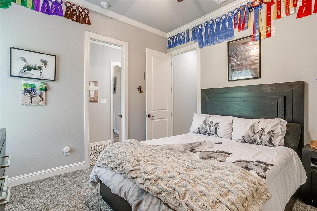 2161 Eagles Rdg Drive Weatherford, TX 76087 - Photo 23 of 40 a bedroom with a bed and a painting on the wall