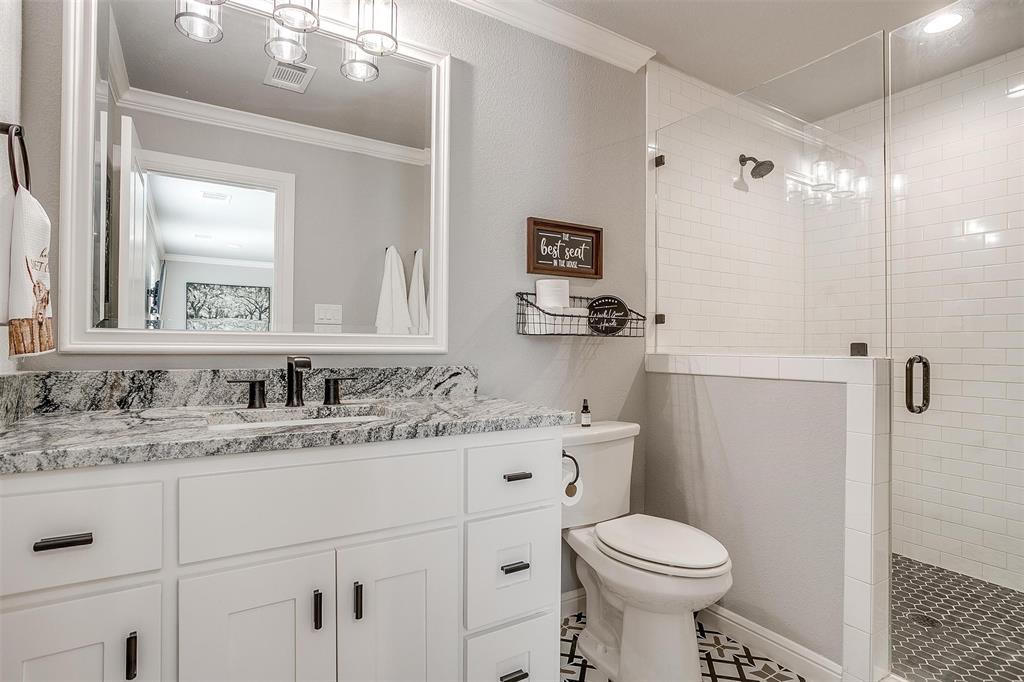 2161 Eagles Rdg Drive Weatherford, TX 76087 - Photo 29 of 40 a bathroom with a sink toilet and a mirror