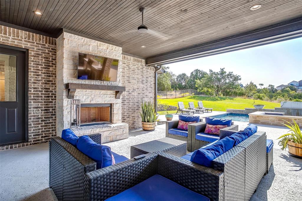 2161 Eagles Rdg Drive Weatherford, TX 76087 - Photo 33 of 40 a living room with furniture and a fireplace
