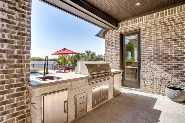 a view of a swimming pool with a lounge chair and swimming pool
