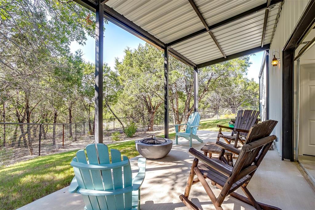 2161 Eagles Rdg Drive Weatherford, TX 76087 - Photo 38 of 40 a view of a porch with furniture and a yard