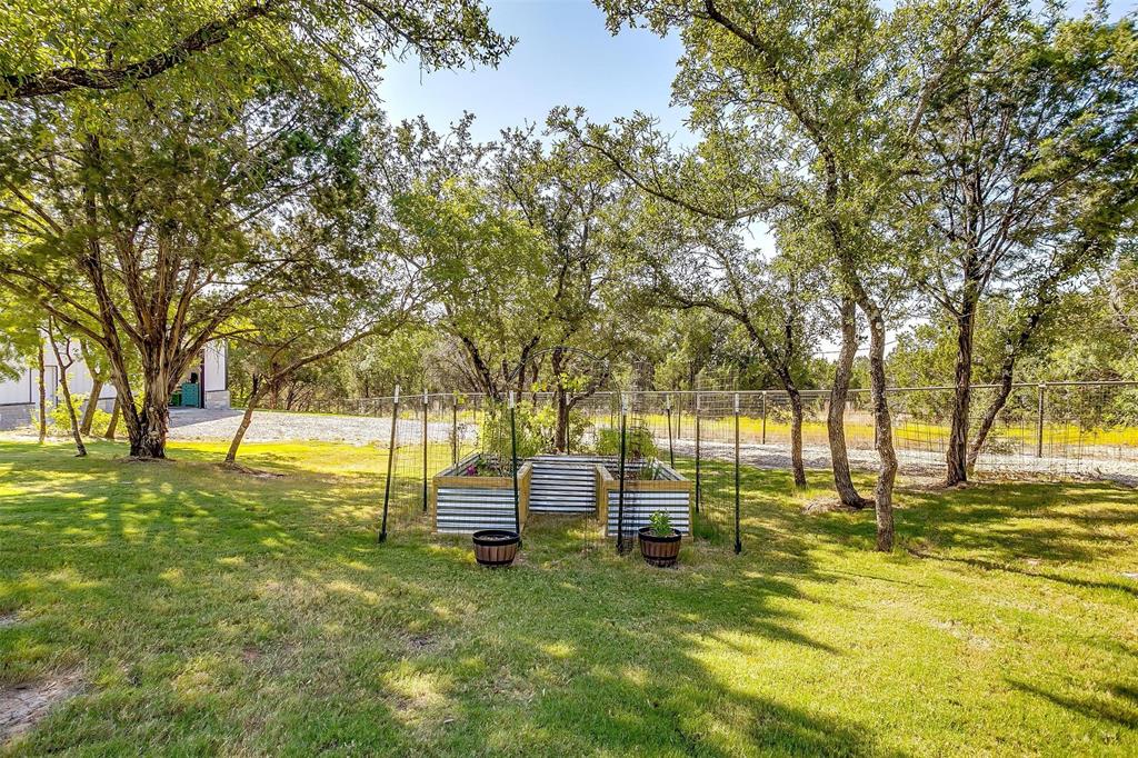 2161 Eagles Rdg Drive Weatherford, TX 76087 - Photo 40 of 40 a view of yard with swimming pool and trees