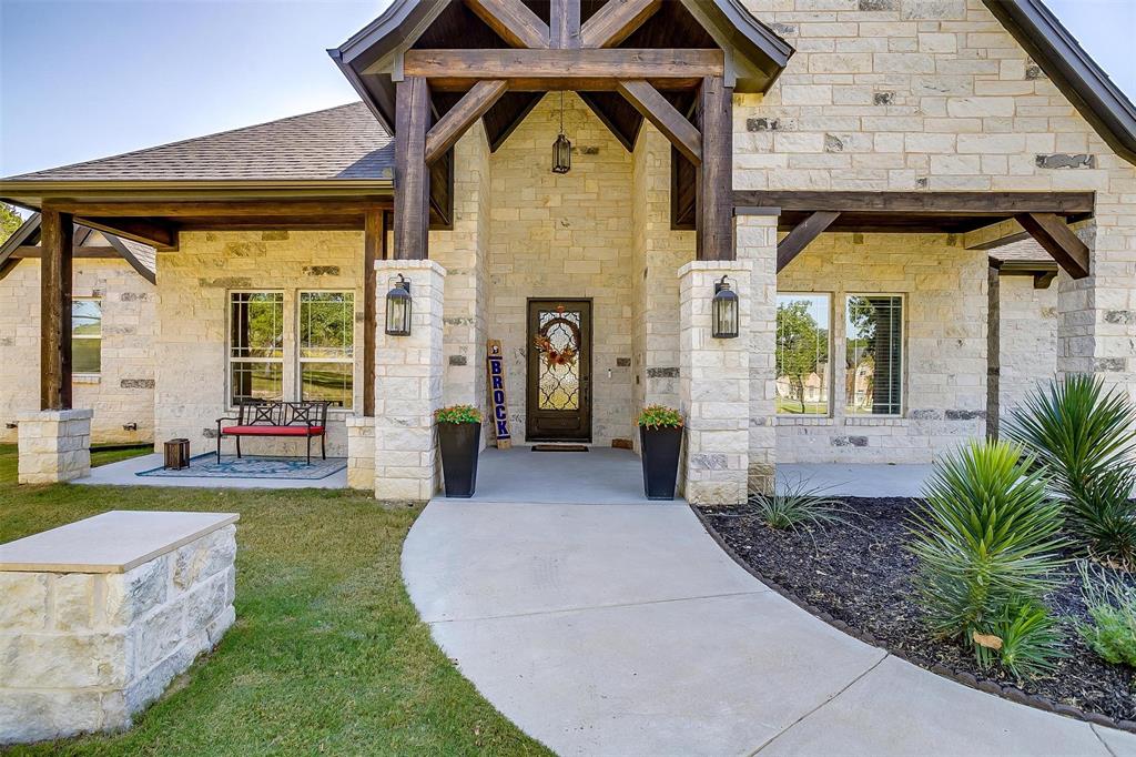 2161 Eagles Rdg Drive Weatherford, TX 76087 - Photo 6 of 40 a front view of a house with garden