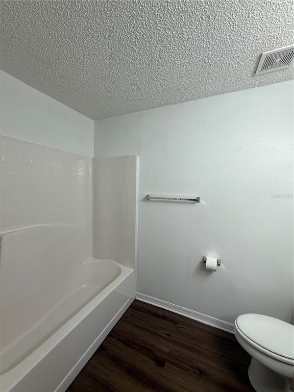 2156 Deltona Boulevard Spring Hill, FL 34606 - Photo 16 of 21 a bathroom with a granite countertop bathtub