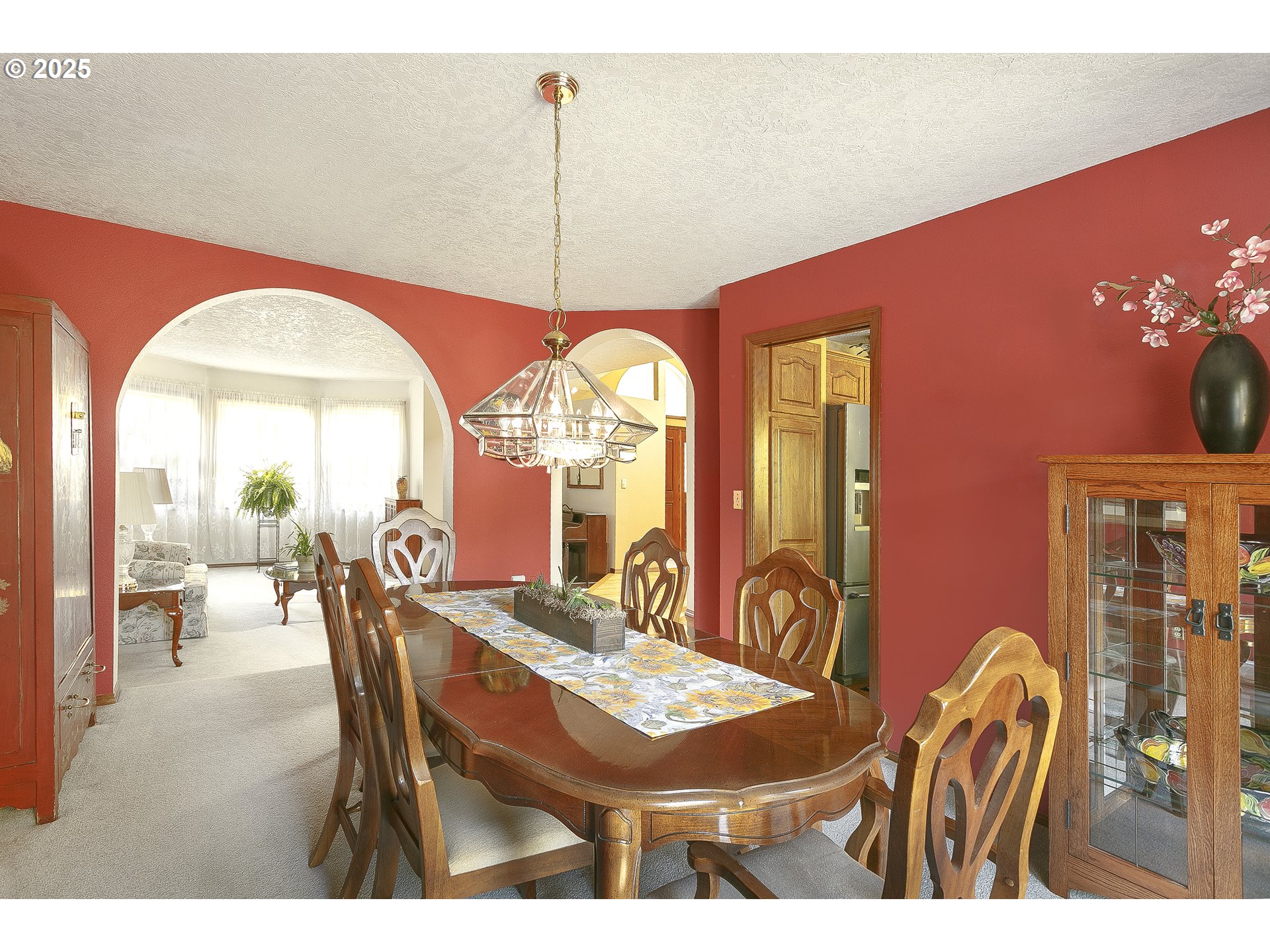 5400 Southeast Chase Road Gresham, OR 97080 - Photo 12 of 47 a dining room with furniture a chandelier and a rug