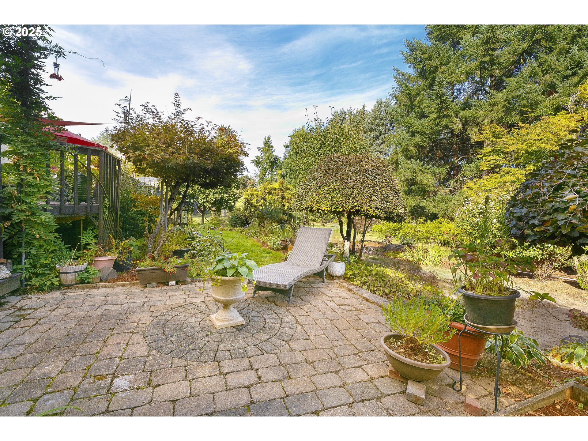 5400 Southeast Chase Road Gresham, OR 97080 - Photo 38 of 47 a view of a patio with table and chairs and potted plants