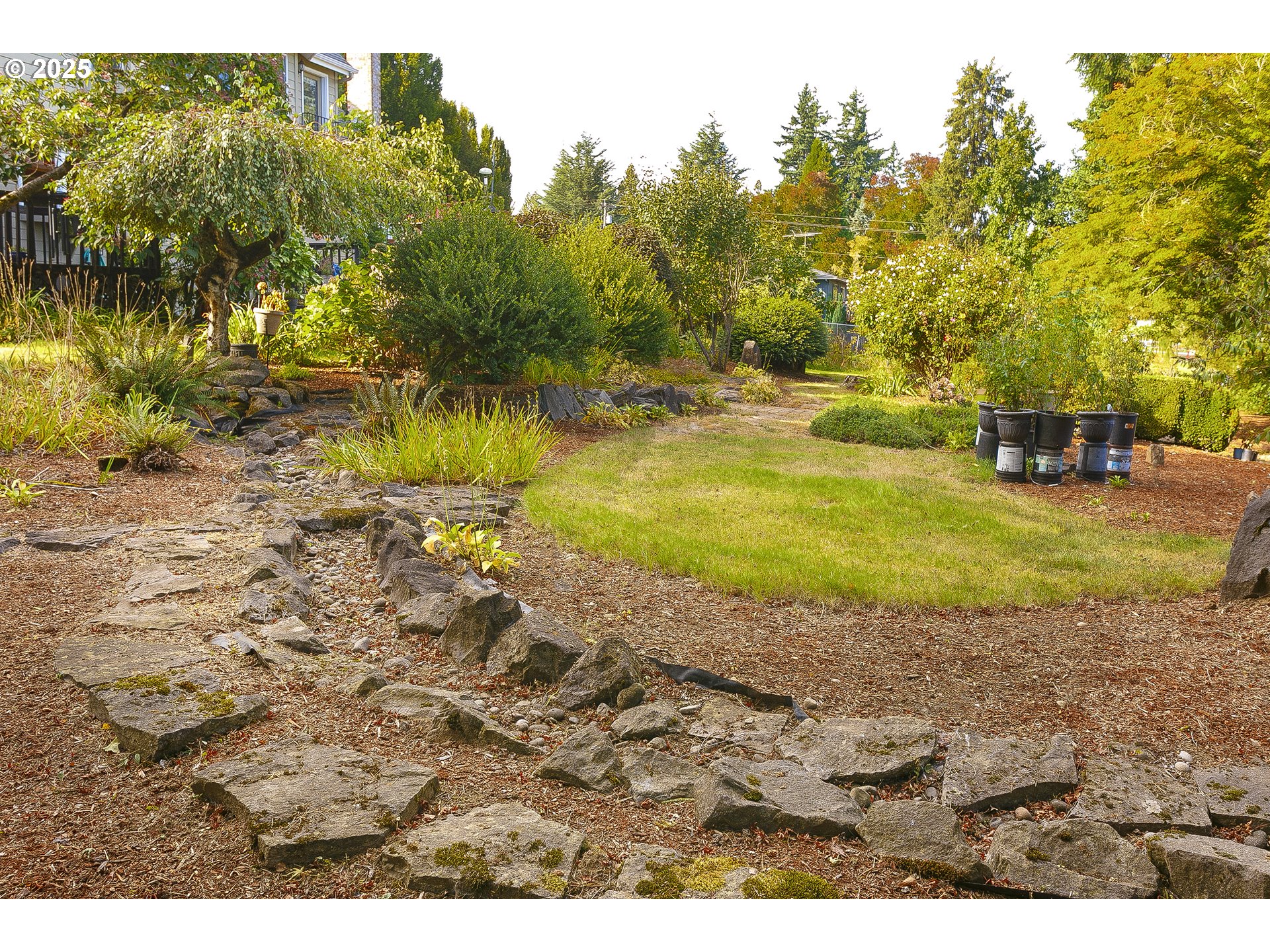 5400 Southeast Chase Road Gresham, OR 97080 - Photo 41 of 47 a view of a yard with a table and chairs