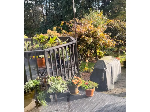 a vase of flowers sitting on a floor