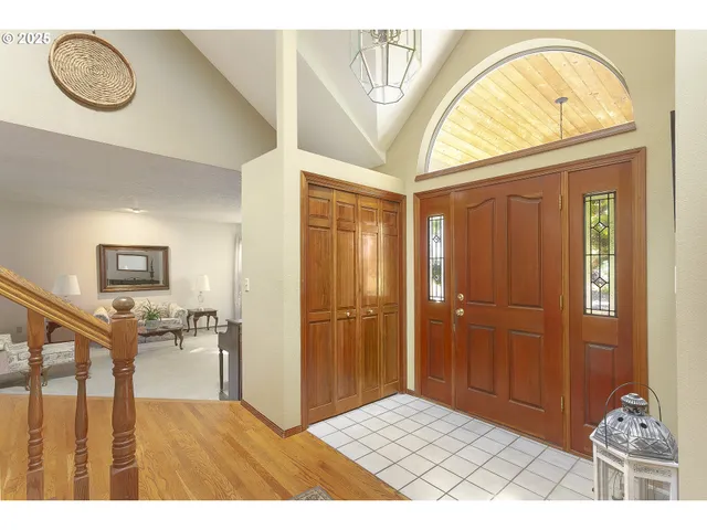 a view of an entryway with wooden floor