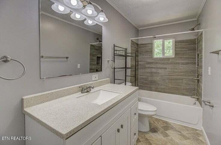 775 Middle Creek Road Cosby, TN 37722 - Photo 23 of 50 a bathroom with a sink a toilet a mirror and shower