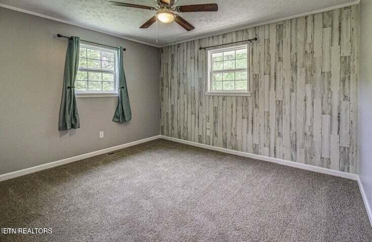 775 Middle Creek Road Cosby, TN 37722 - Photo 25 of 50 an empty room with windows and closet