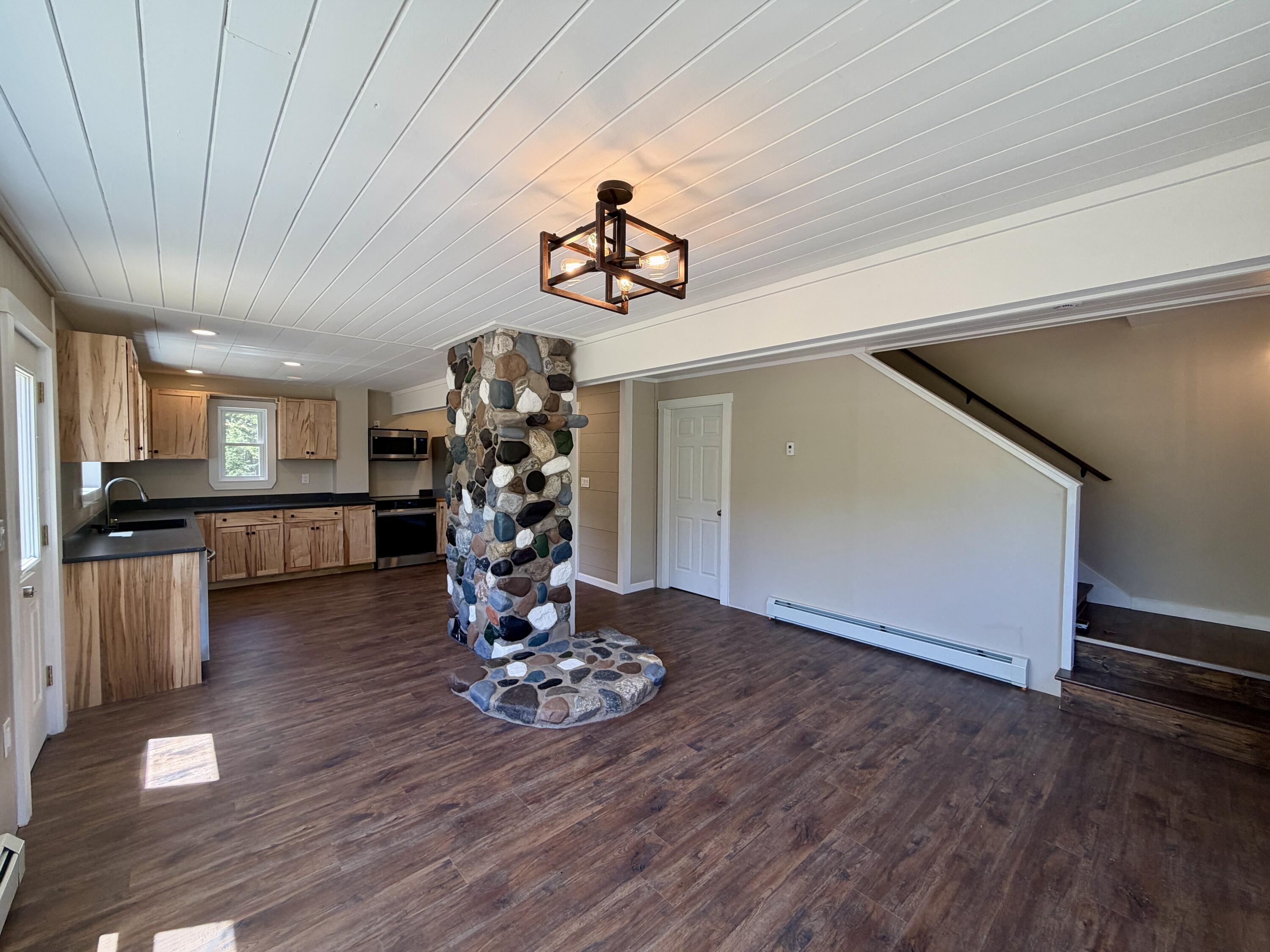 51 Big Boyd Lake Road Milo, ME 04463 - Photo 25 of 64 Living Room to Kitchen