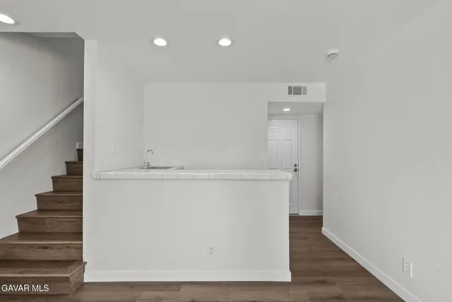 a view of entryway with wooden floor