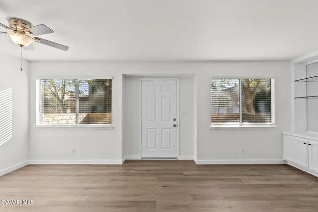 a view of an empty room with a window