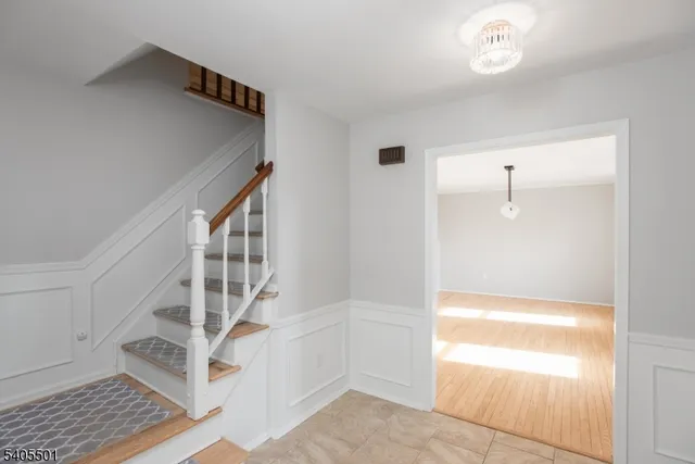 a view of an entryway with wooden floor