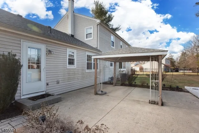 a view of a house with backyard and porch