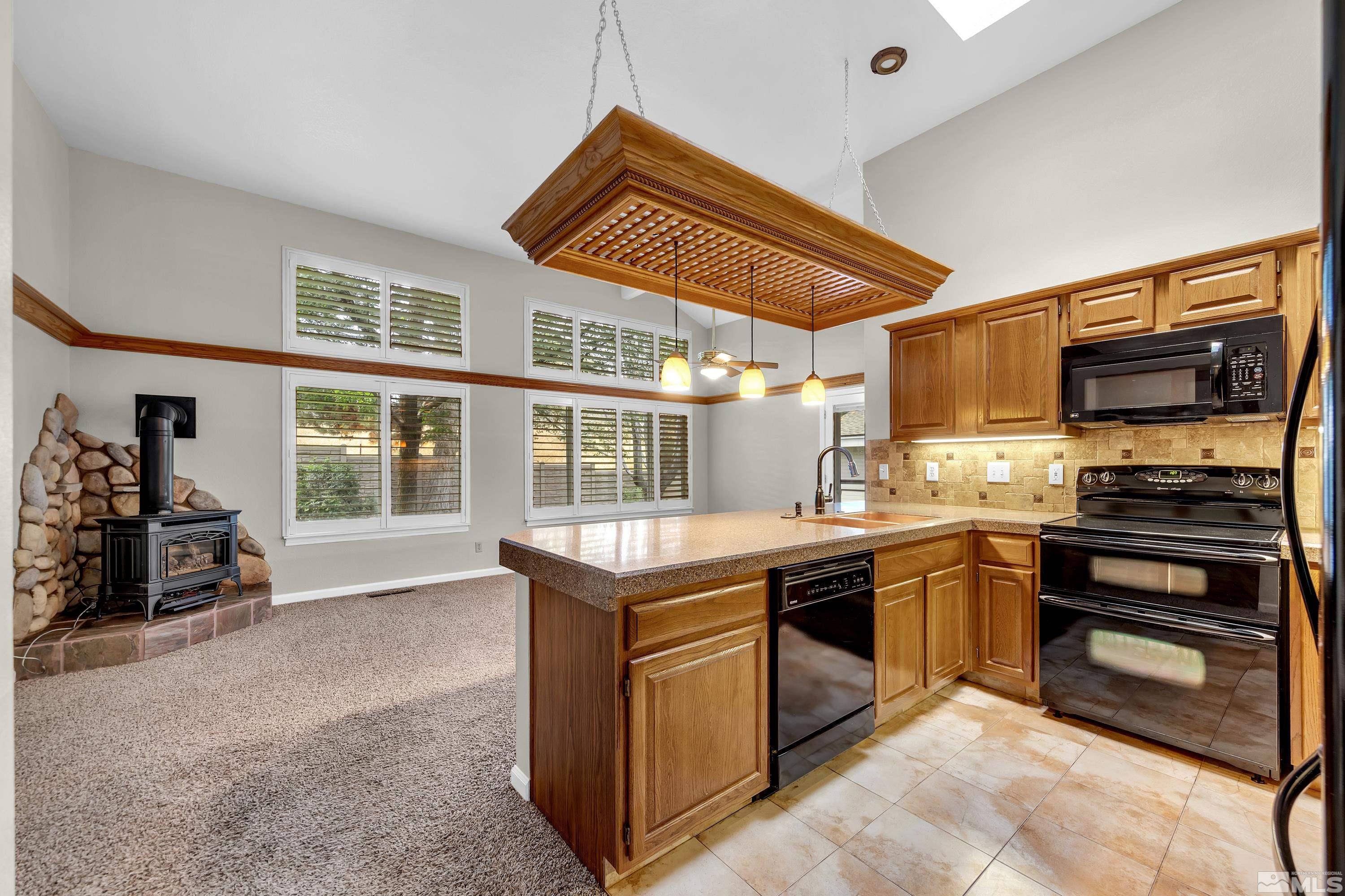 3336 Spring Creek Circle Reno, NV 89509 - Photo 17 of 36 a kitchen with stainless steel appliances granite countertop a stove and a sink